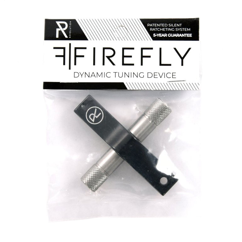 Revolution Firefly 2 Trommenøgle vist i sin emballage (lille pose med papkort foroven).