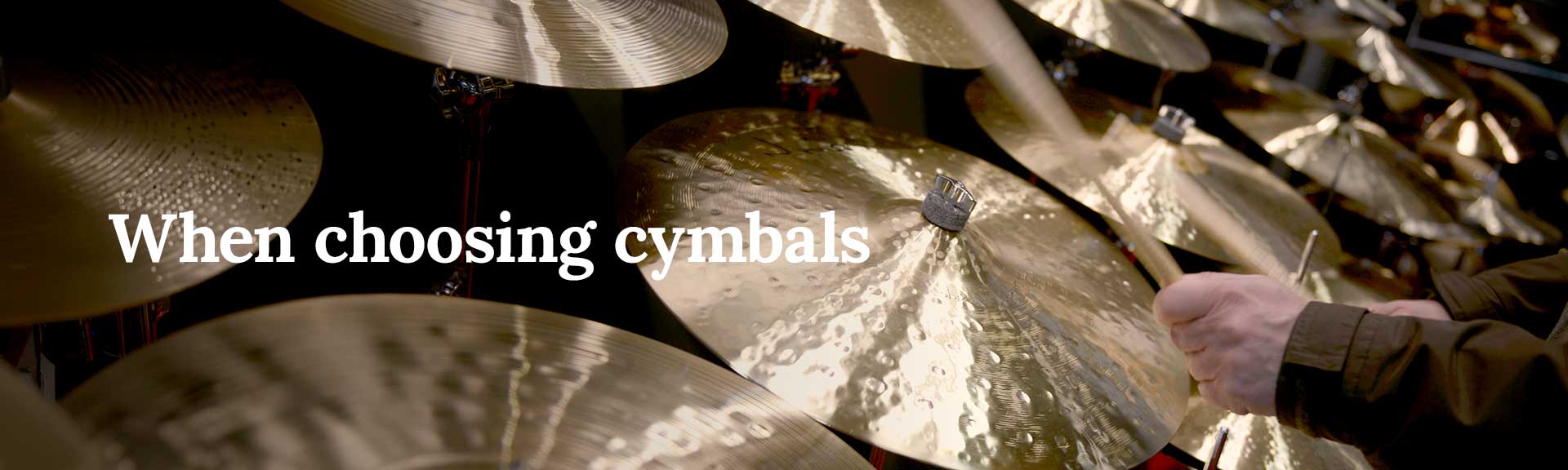 drummer testing different cymbals